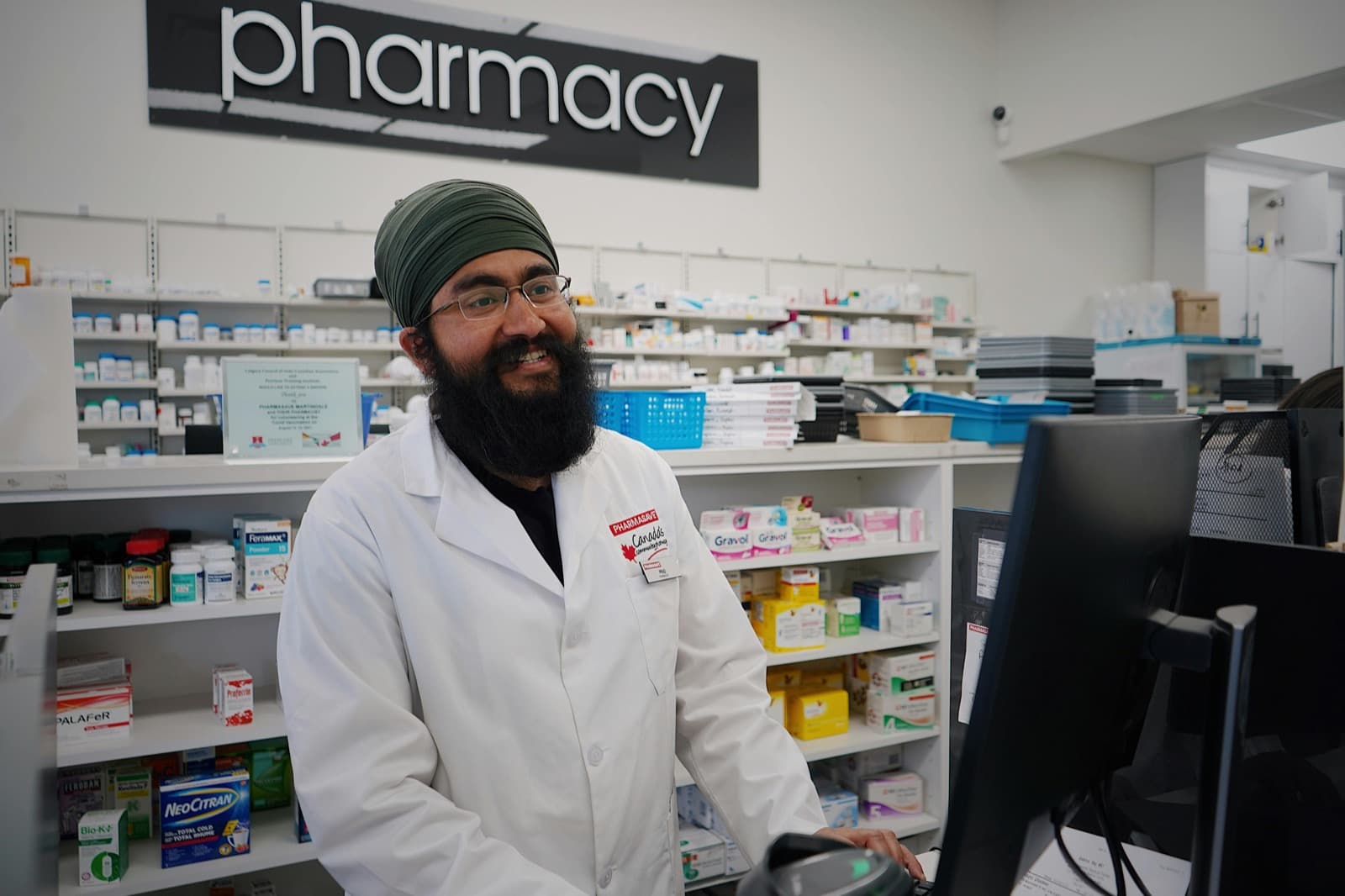 Pharmacist working at a pharmacy counter.