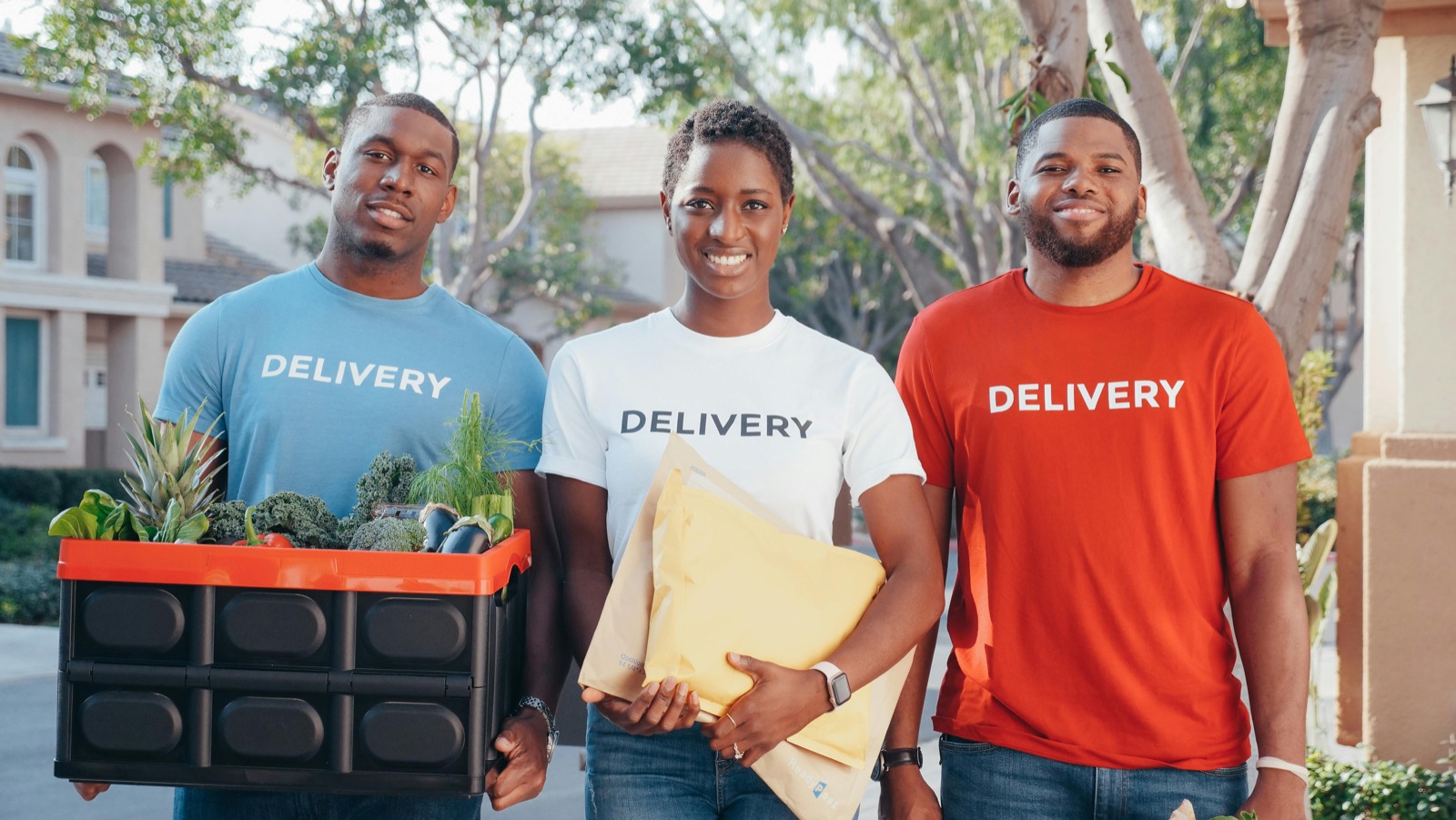 A fleet operator standing with a local delivery team