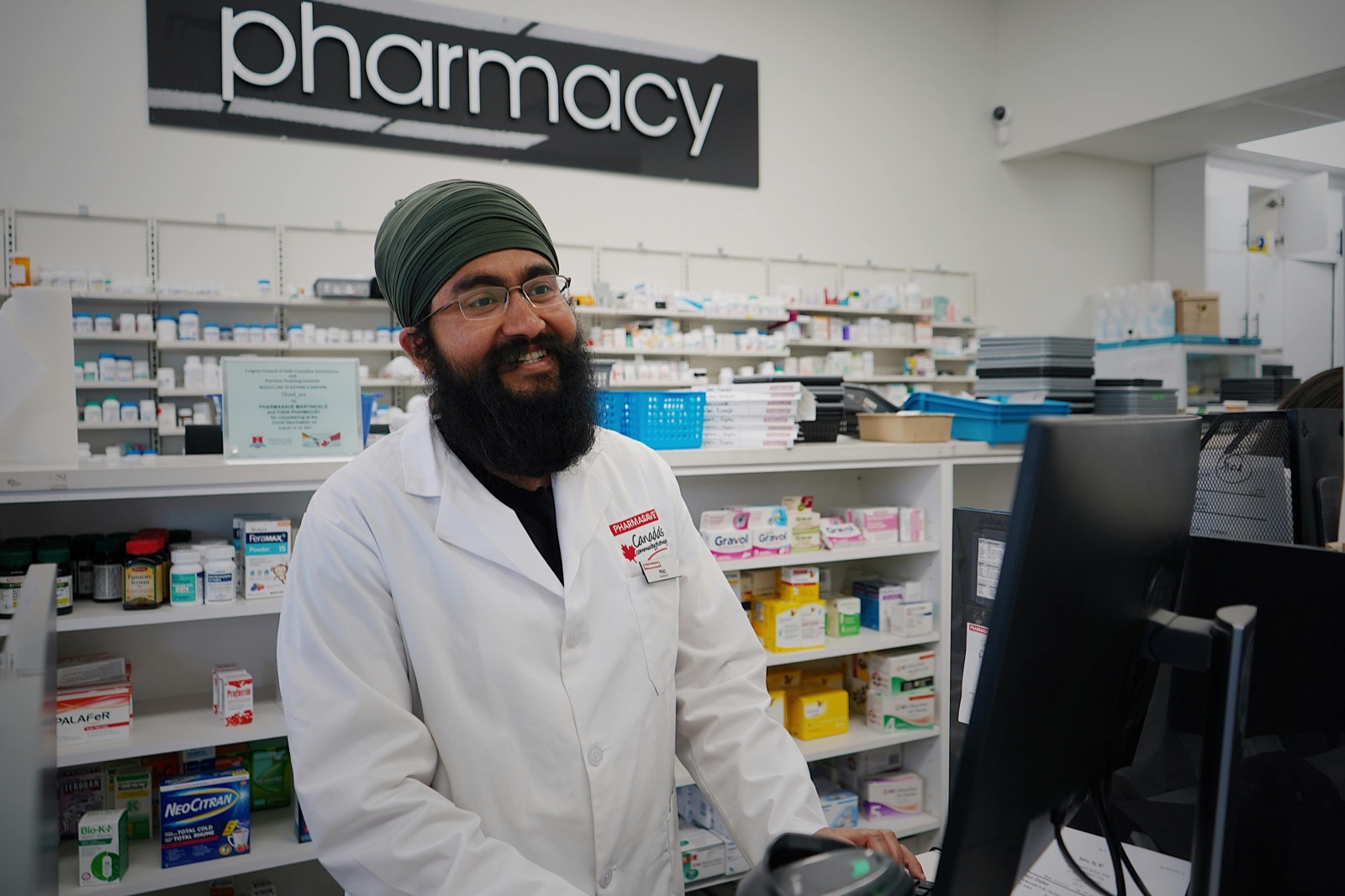 Pharmacist working at a pharmacy counter
